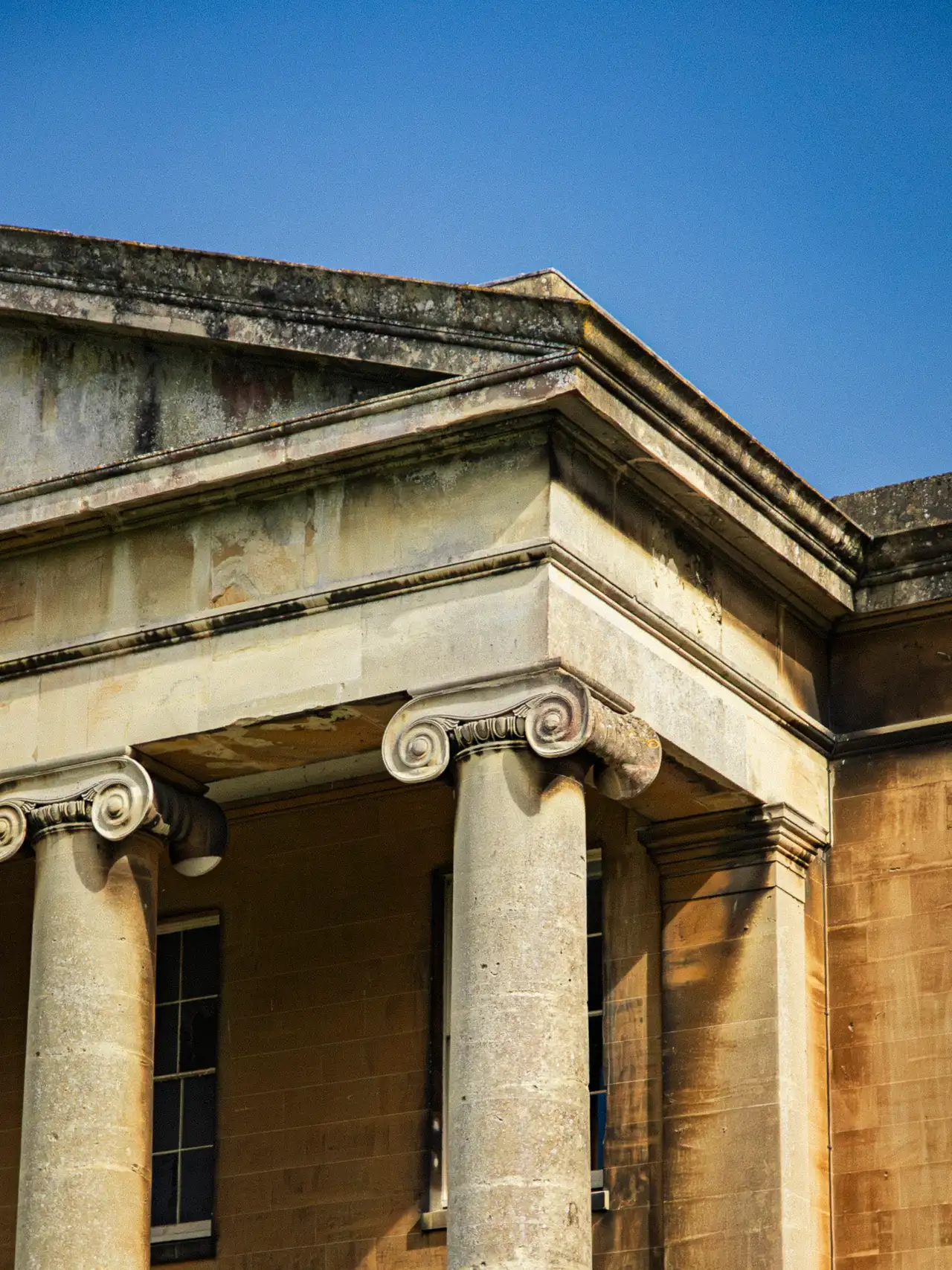 Architectural detail of the Palladian facade in spring sunlight.